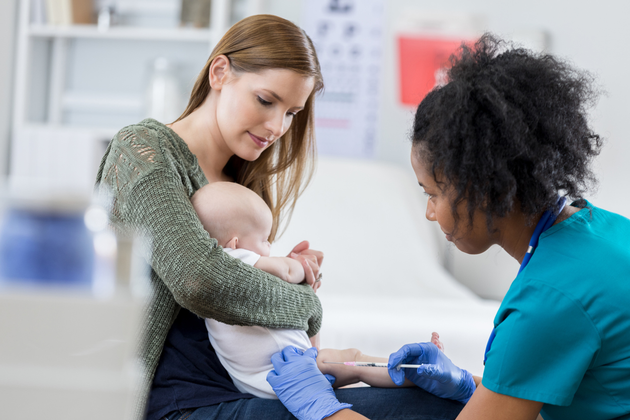 Baby receiving vaccine 676570572