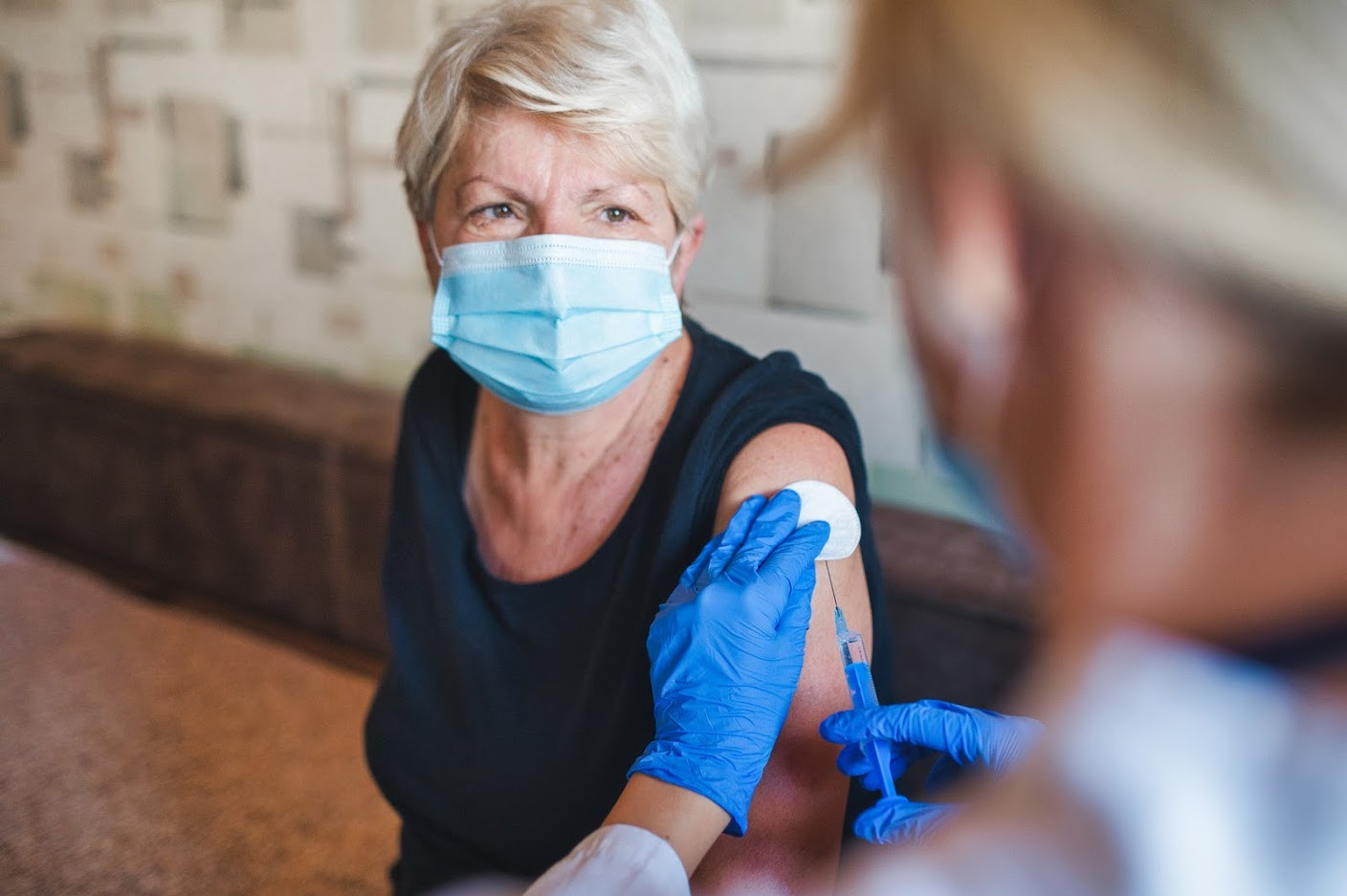 Woman receiving vaccination.