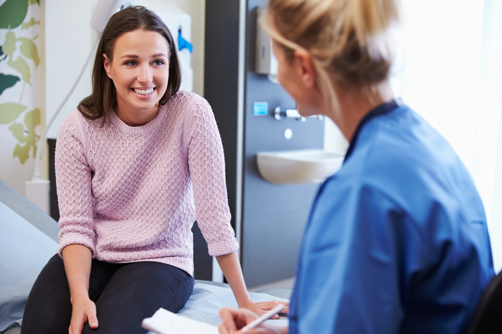 Nurse with female patient.