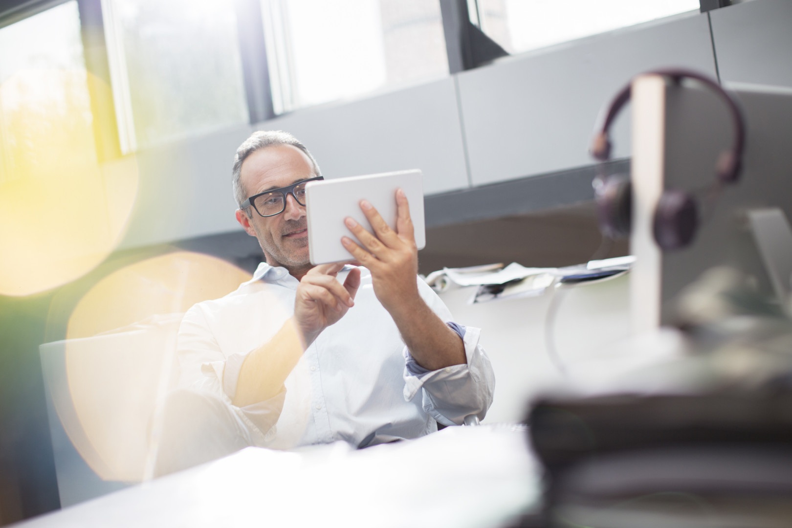 Man participating in webinar via ipad device.