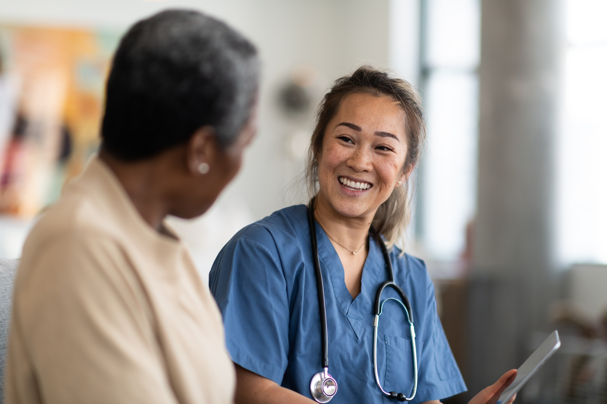 Female GP speaking with a patient