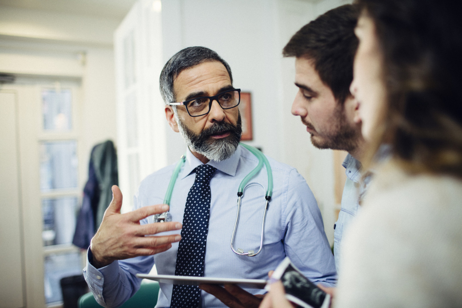 Doctor speaking with patients.