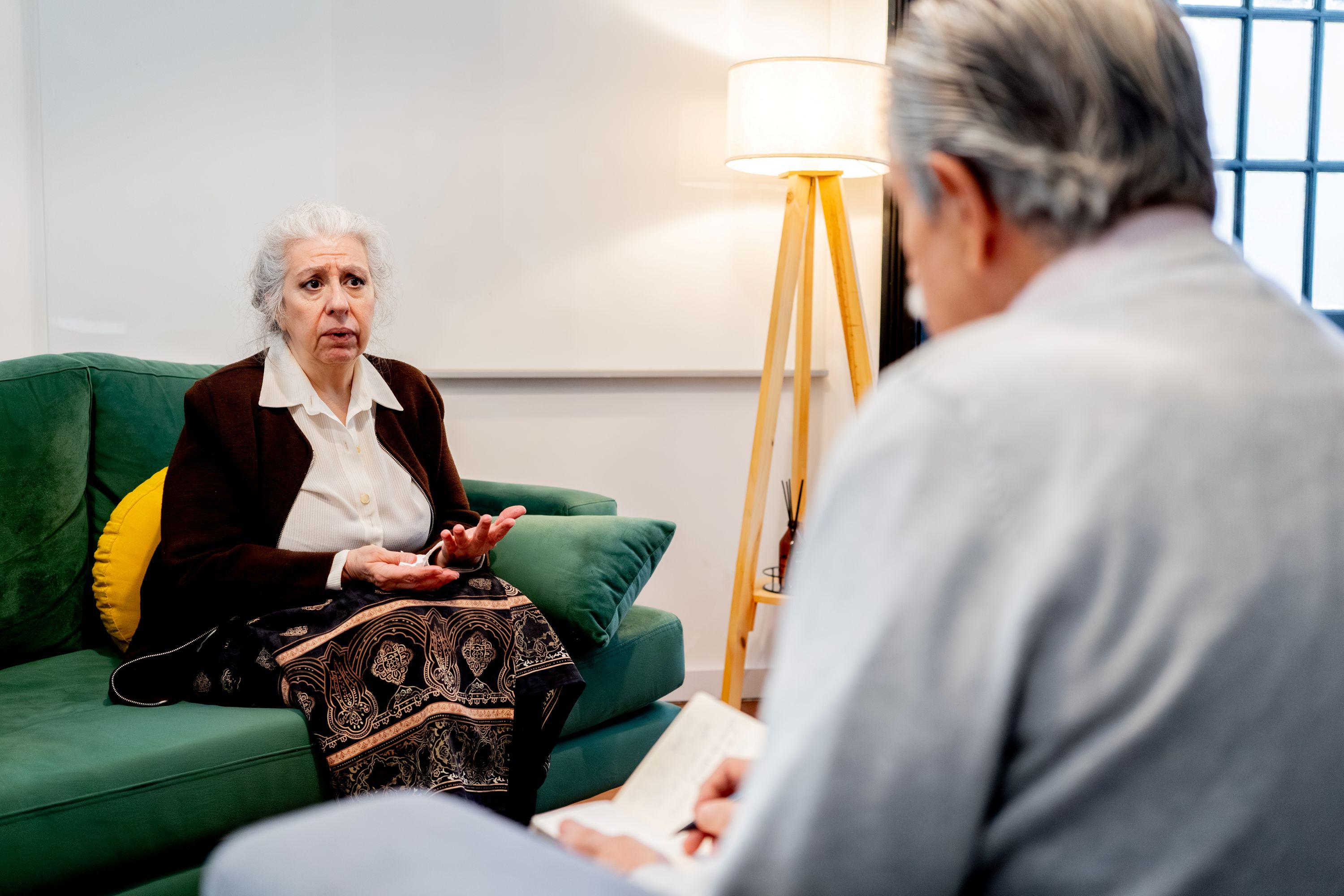 Older woman speaking with a health professional