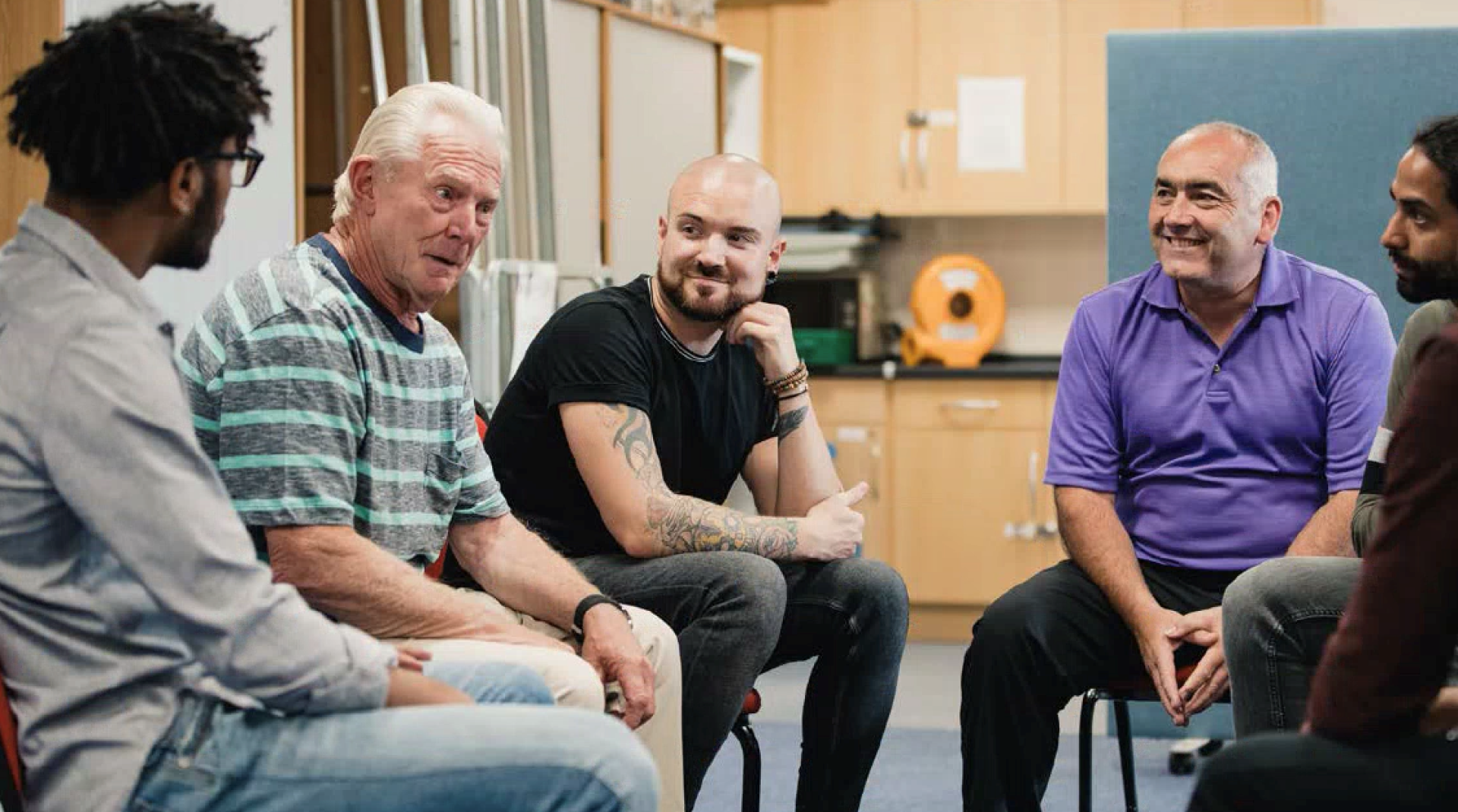 Group of men talking.