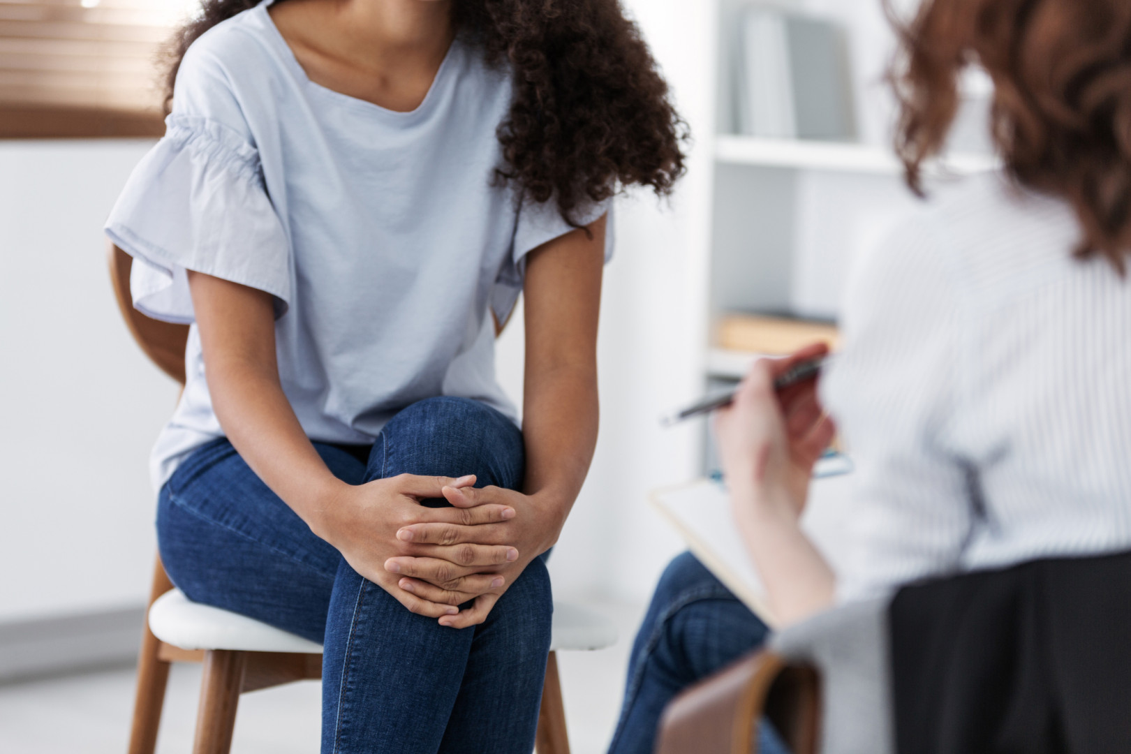 Woman speaking with psychologist.