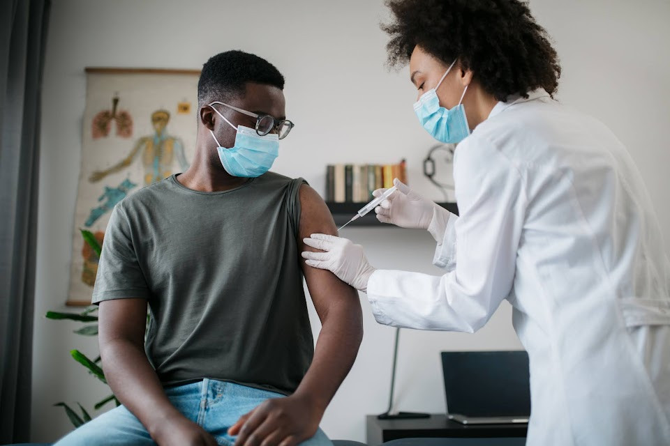 Man receiving vaccination.