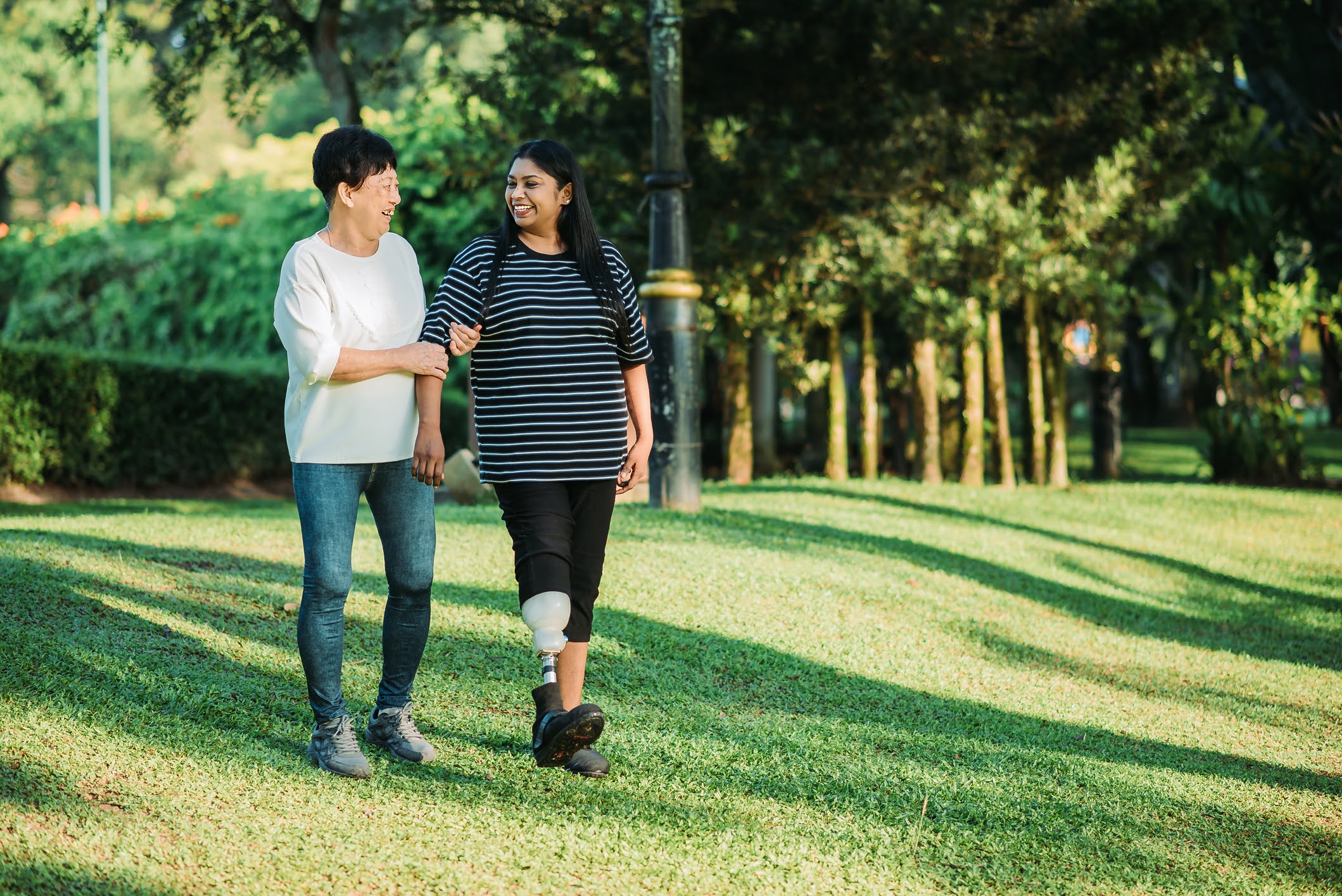 two people walking down a hill